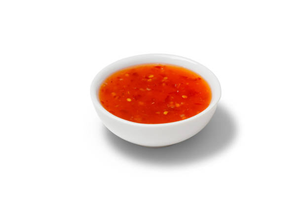 istock Chilli sauce in a gravy boat on white background 919338850