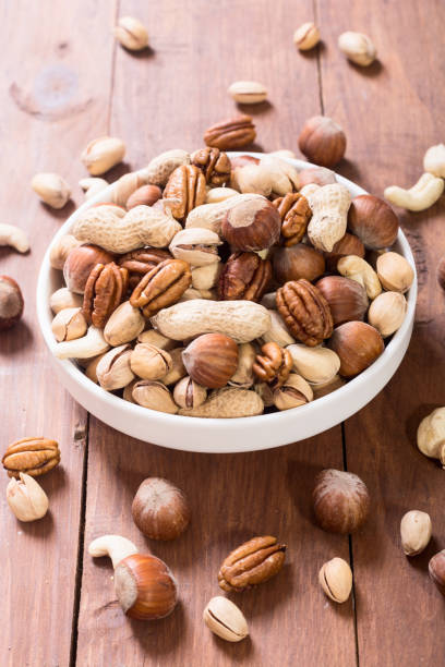 istock Mix of nuts in plate 919346498