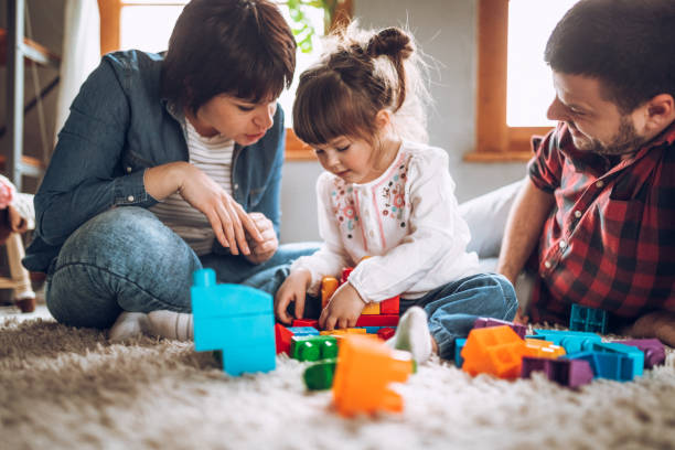 istock Sweet child playing with parents 919352228