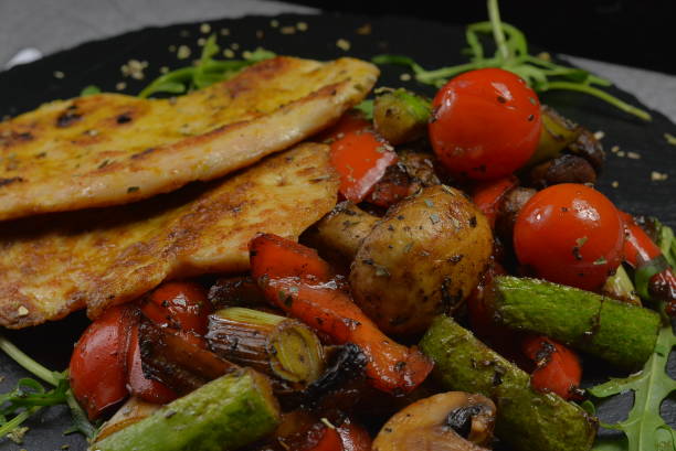 istock Fried Chicken Breast and Grilled Vegetables 919359062