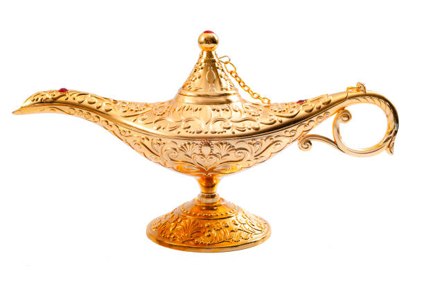 Magic lamp and granting wishes concept Grant a wish, desiring financial wealth with a old golden magic lamp isolated on white background with clipping path magic lamp photos stock pictures, royalty-free photos & images