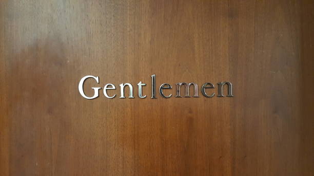 istock wooden door silver gentlemen sign 919377516