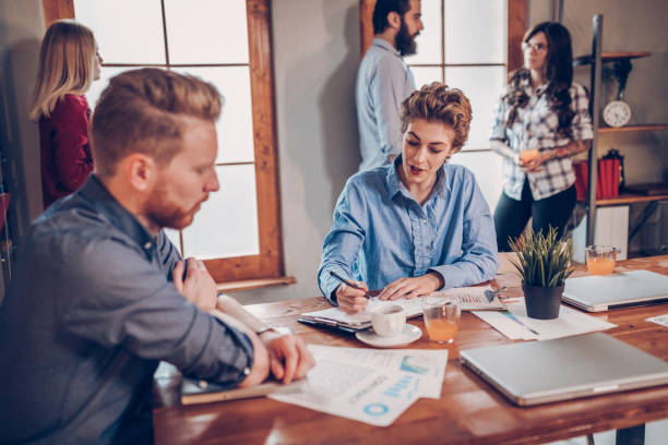 istock Co-workers discussing about new business ideas 919381992