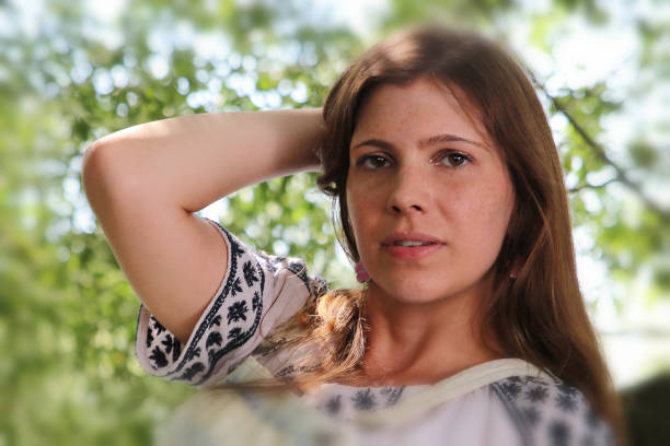 istock Young woman with freckles 919385052