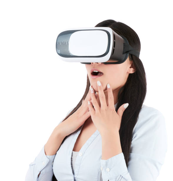 istock Young woman is using VR headset on white background 919387262