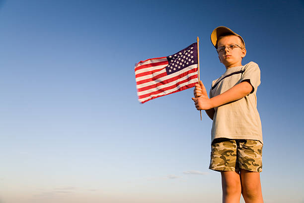 bandera estadounidense - child patriotism saluting flag fotografías e imágenes de stock