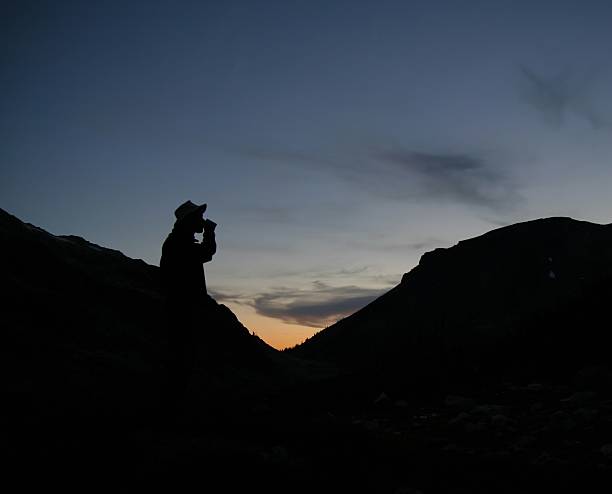 istock Silhoutte of Hiker Drinking from Mug in the Mountains 91941396