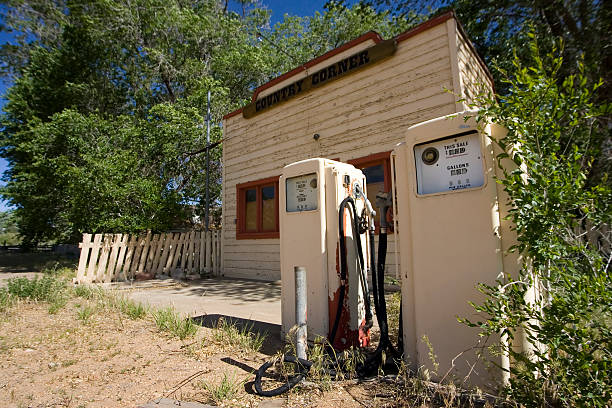 Two old analog gas pumps in front of a deserted gas station in southern Utah.