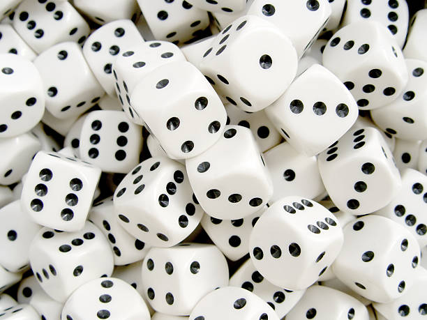 Several dice piled on top of each other stock photo