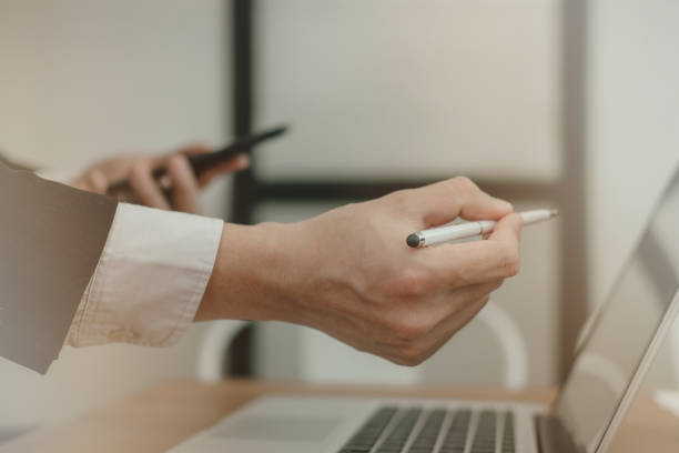 istock businesman analyze financial chart in smartphone. man working with startup project. business adviser inspecting market plan report at workplace. 919415544