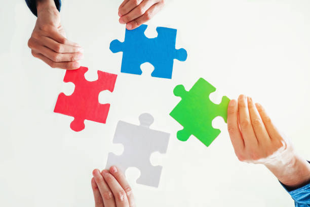 istock Teamwork meeting Business  Jigsaw Puzzle solution together concept 919424110