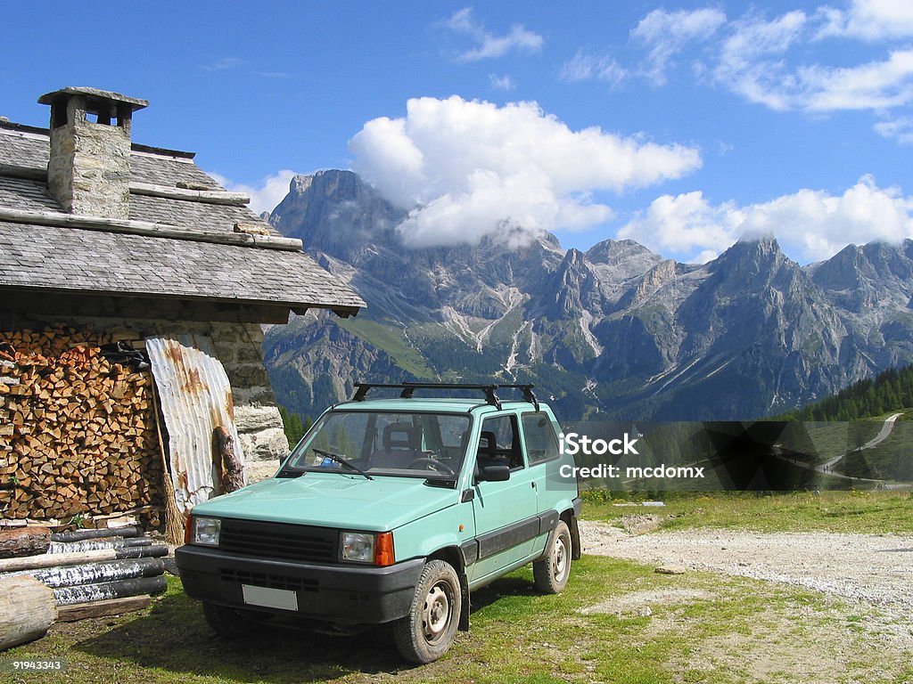 Car on Top of Dolomite Mountain  Achievement Stock Photo