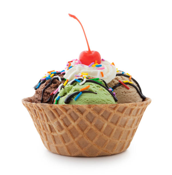 Ice Cream Sundae Ice cream sundae in waffle bowl isolated on white (excluding the shadow) whipped food photos stock pictures, royalty-free photos & images