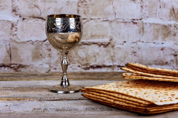 istock Passover holiday concept with wine and matzoh over rustic background with copy space 919443708