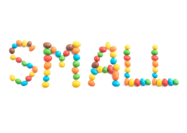 istock Word small, of multicolored candies isolated on white background 919447272