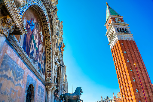 Saint Mark's Basilica Mosaic Horses Campanile Bell Tower Piazza San Marco Saint Mark's Square Venice Italy.  First erected in 1173. Church created 1063 AD, Saint Mark's relics moved to this church