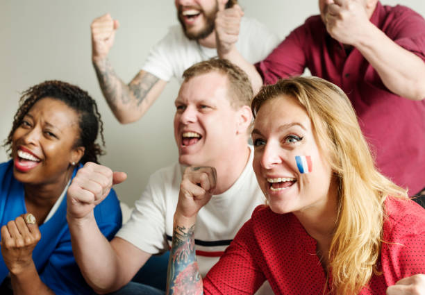 istock Friends cheering world cup with painted flag 919489030