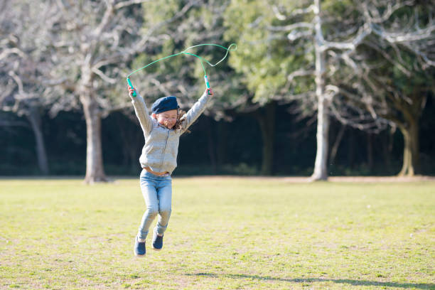 istock Little girl practicing jump rope 919489052
