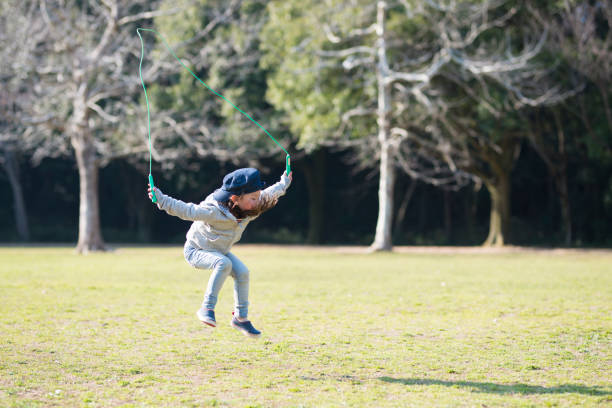 istock Little girl practicing jump rope 919489066