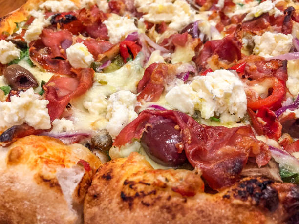 istock Pizza Time: extreme close-up brick oven Italian-style pizza ingredients 919496826