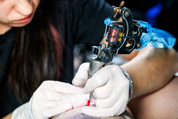 istock professional tattoo artist 919497194