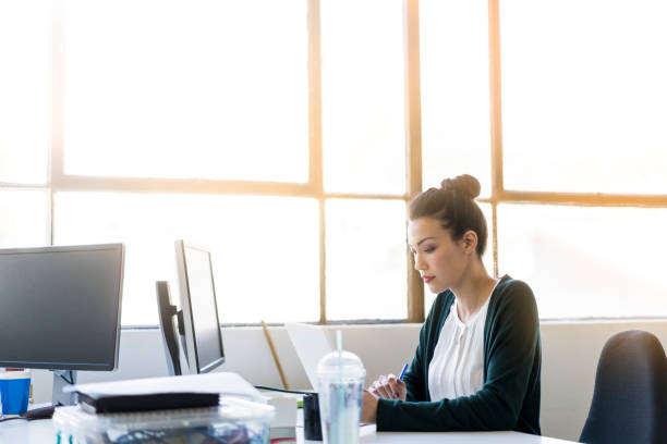 istock Young businesswoman using digital tablet in office 919502128
