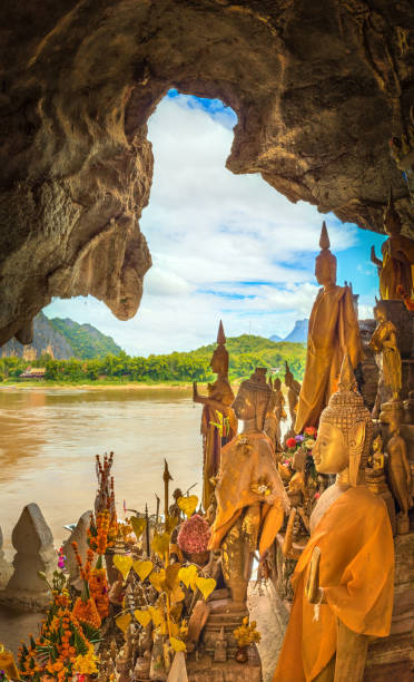 View from the cave. Beautiful landscape. Laos. View from the Pak Ou cave. Buddha statue on the foreground. Luang Prabang. Laos. laos photos stock pictures, royalty-free photos & images