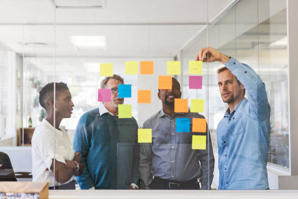istock Business people with adhesive notes in office 919504594