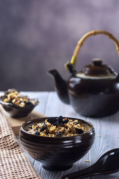 istock Oatmeal porridge with walnuts and raisins 919507322