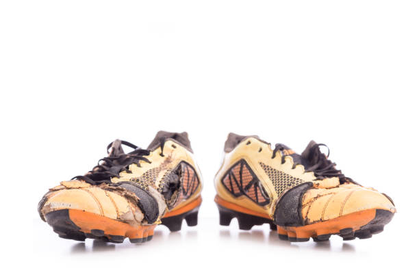istock Old football shoes isolated on white 919512314