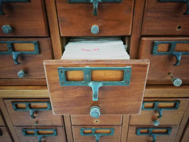 istock Open wooden boxes with index cards in library 919515108