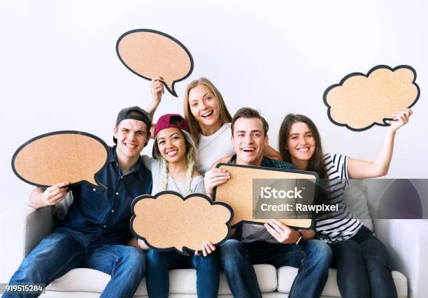 Happy Young Adults Holding Up Copyspace Placard Thought Bubbles Stock Photo - Download Image Now