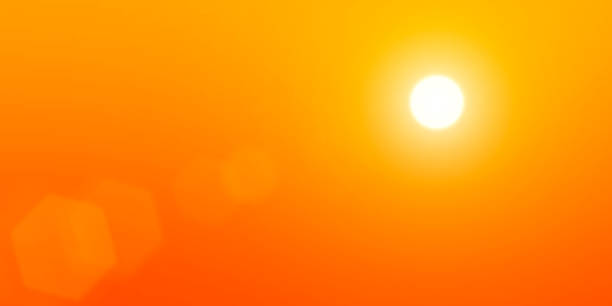The sun is in the sky The sun on a background of orange sky. orange sunset stock pictures, royalty-free photos & images