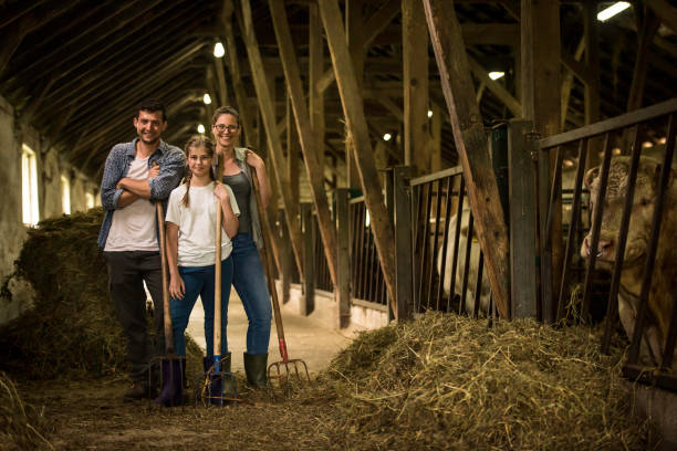 Herders standing in shed