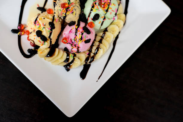istock ice cream sundae vanilla strawberry chocolate lemon scoops with banana. 919521036
