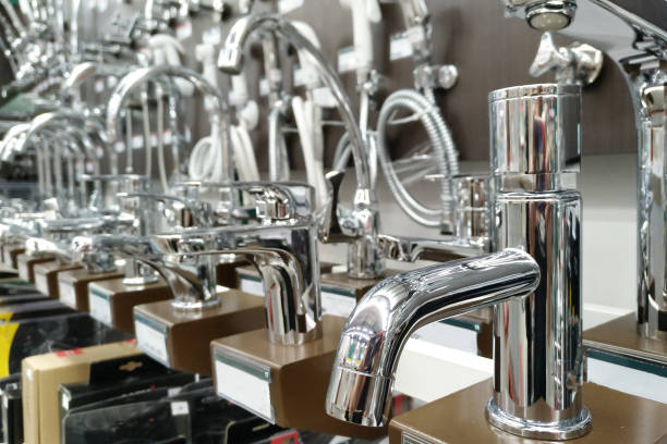 istock closeup faucets on shelf.Modern kitchenware water faucets in the store 919524720