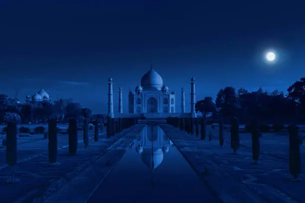 Photo of Taj Mahal in Agra, India in the light of the full moon