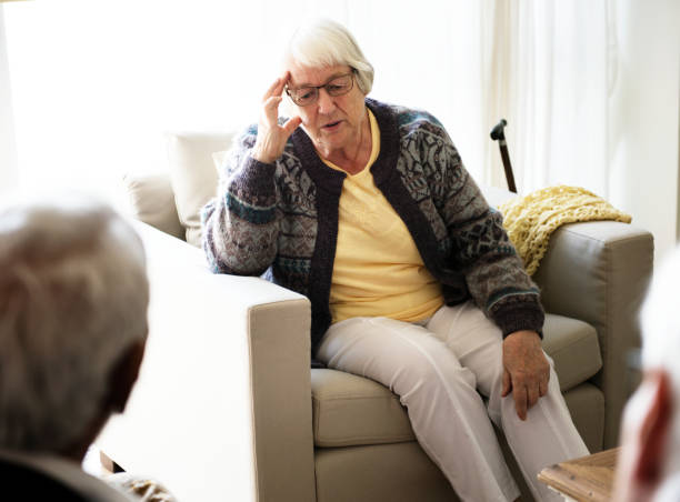 istock Senior woman sitting on a sofa 919530608