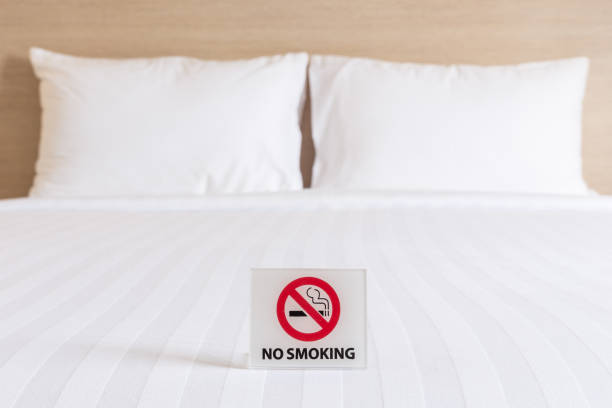 istock NO SMOKING Sign on the bed in hotel room 919533416