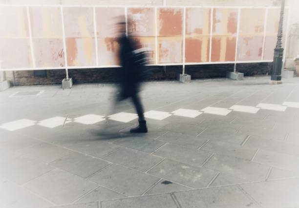 istock isolated blurry person walks in town 919535992