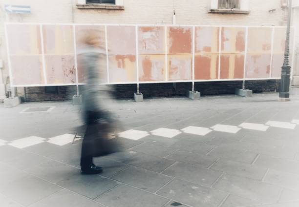 istock isolated blurry person walks in town 919535994