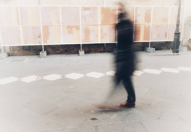 istock isolated blurry person walks in town 919535996