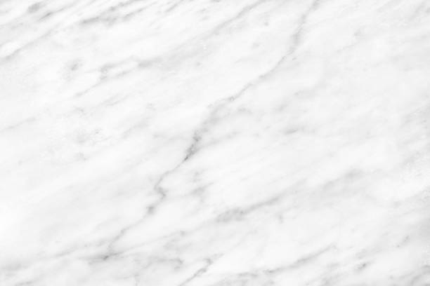 istock White Carrara Marble natural light surface for bathroom or kitchen countertop 919545414
