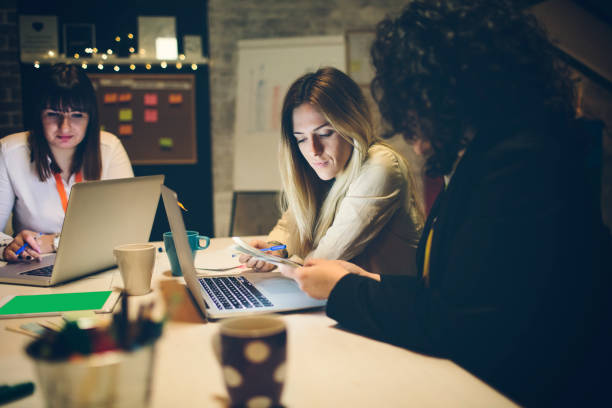 istock Businesswomen Working Late 919547776