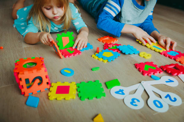 istock kids learning numbers, calculations, play with puzzle 919554986