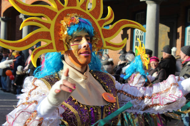 Male Mardi Gras Dancer Aalst, Belgium, 12 February 2018: Unknown Aalst carnival participants celebrate during the annual street parade. Aalst Carnival is recognized by UNESCO as an event of Intangible Cultural Heritage. mardi gras body painting stock pictures, royalty-free photos & images