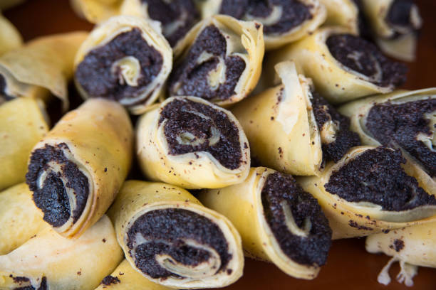 Poppy filling pancakes close-up.
