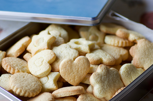 close up of fresh pastry biscuits in a metal box