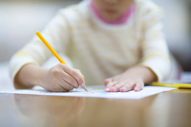 istock Close-up photo of a child hand while drawing 919561124