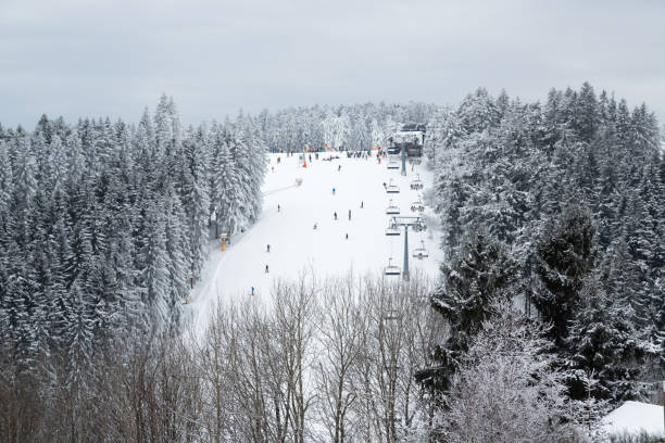 Editorial - Ski Slopes in Winterberg, Germany People skiing on the slopes of Winterberg, in Germany winterberg stock pictures, royalty-free photos & images
